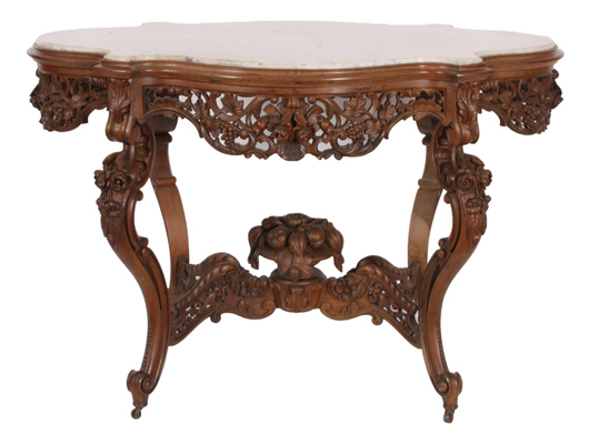 J. & J.W. Meeks rosewood marble-top center table, heavily carved and extremely ornate. Image courtesy of Fontaine’s Auction Gallery.